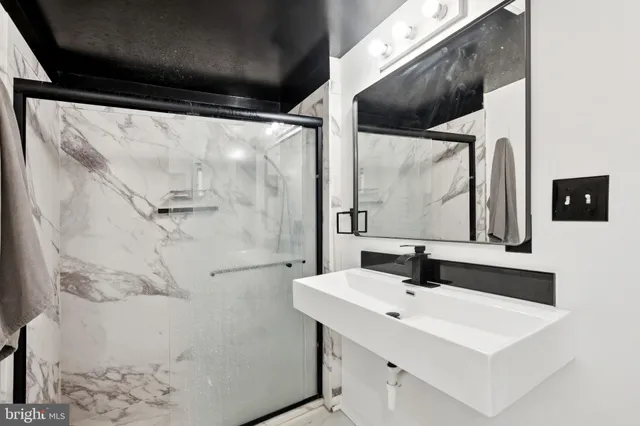 a bathroom with a sink and a mirror