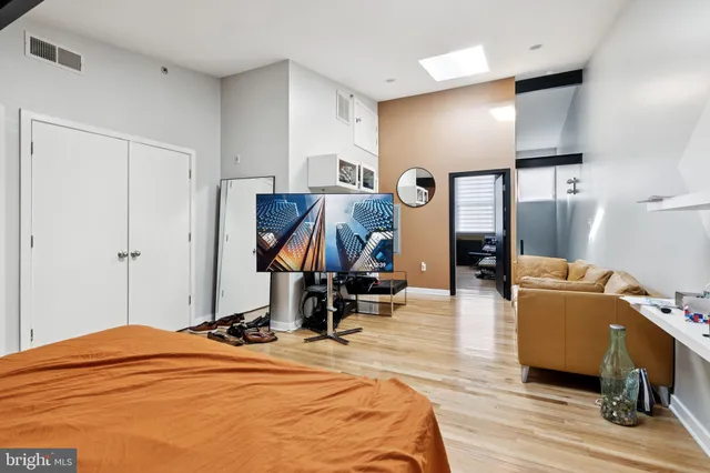 a bedroom with bed and window