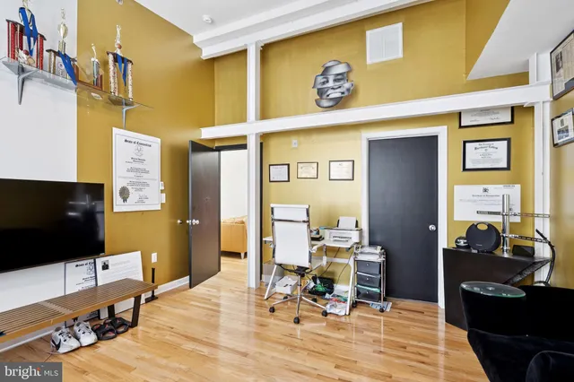 a view of a livingroom with furniture and a flat screen tv