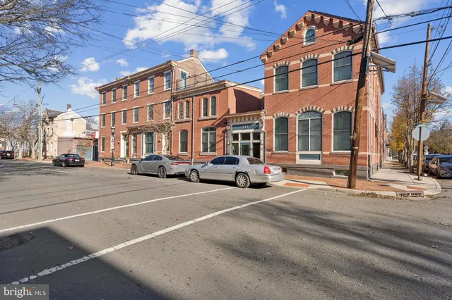a city street lined with buildings and cars