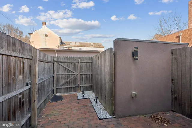 a view of a door and wooden floor