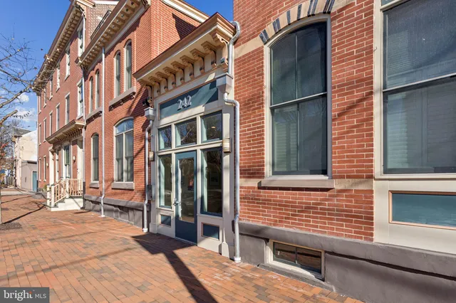 a view of a brick building with many windows