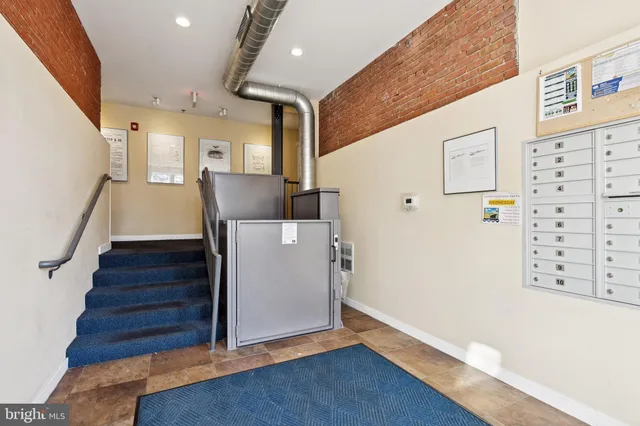 a view of entryway with stairs and wooden floor
