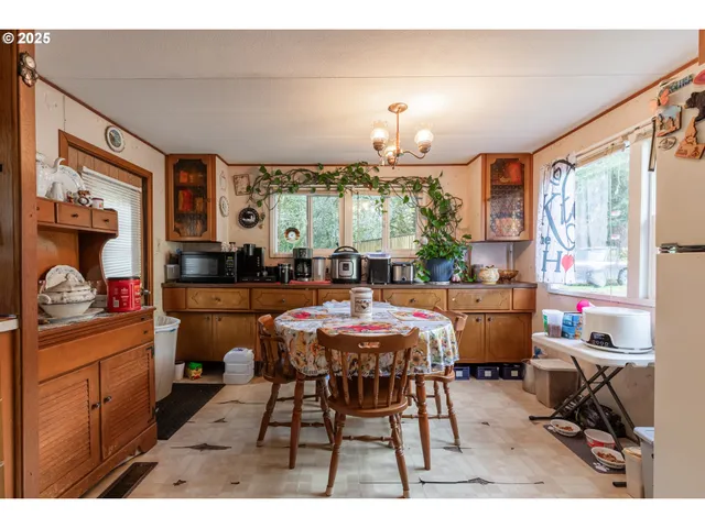 a view of a dining room with furniture window and outside view