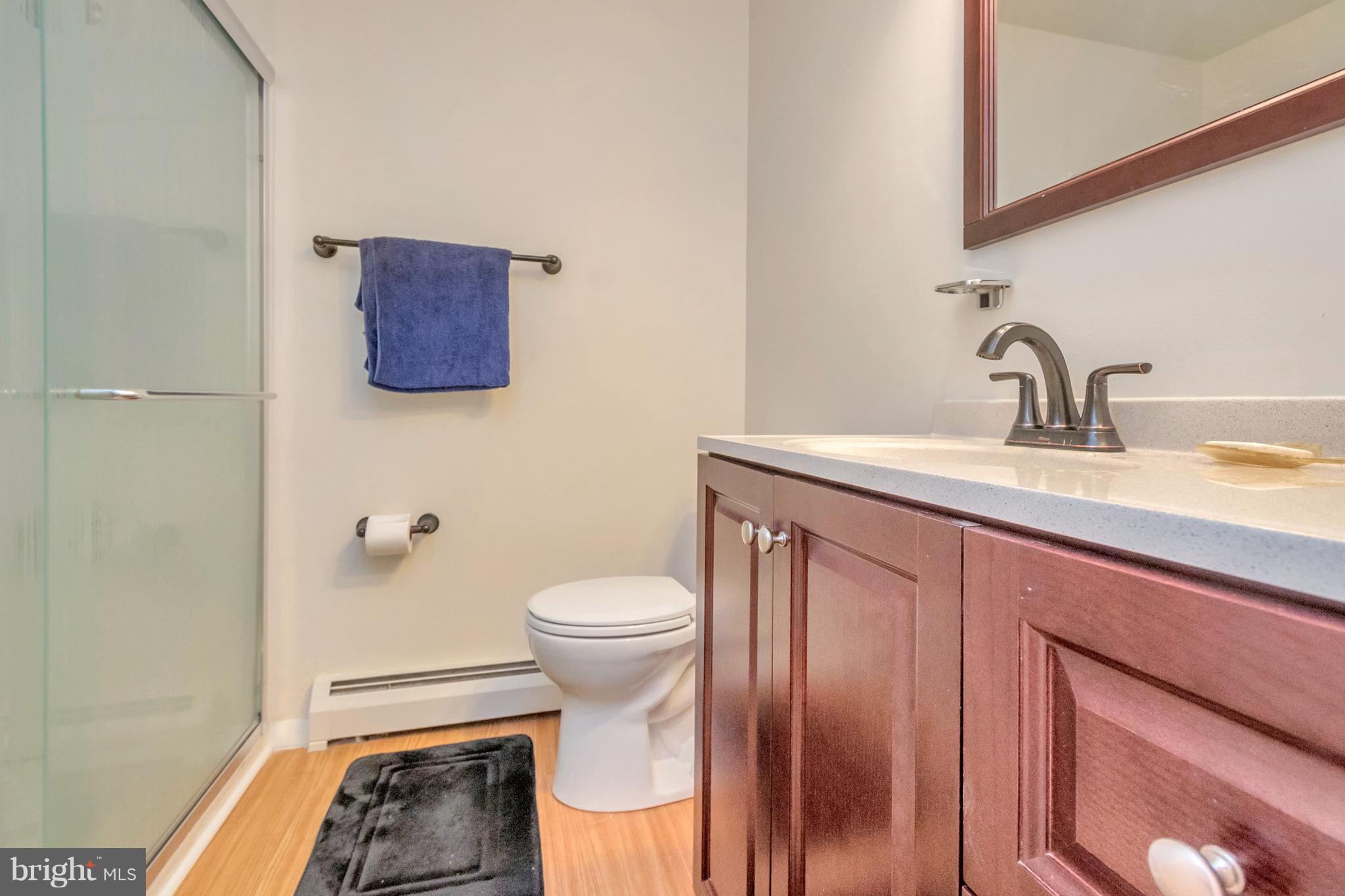 4717 Kilbane Road Woodbridge, VA 22193 - Photo 13 of 29 a bathroom with a toilet sink and mirror