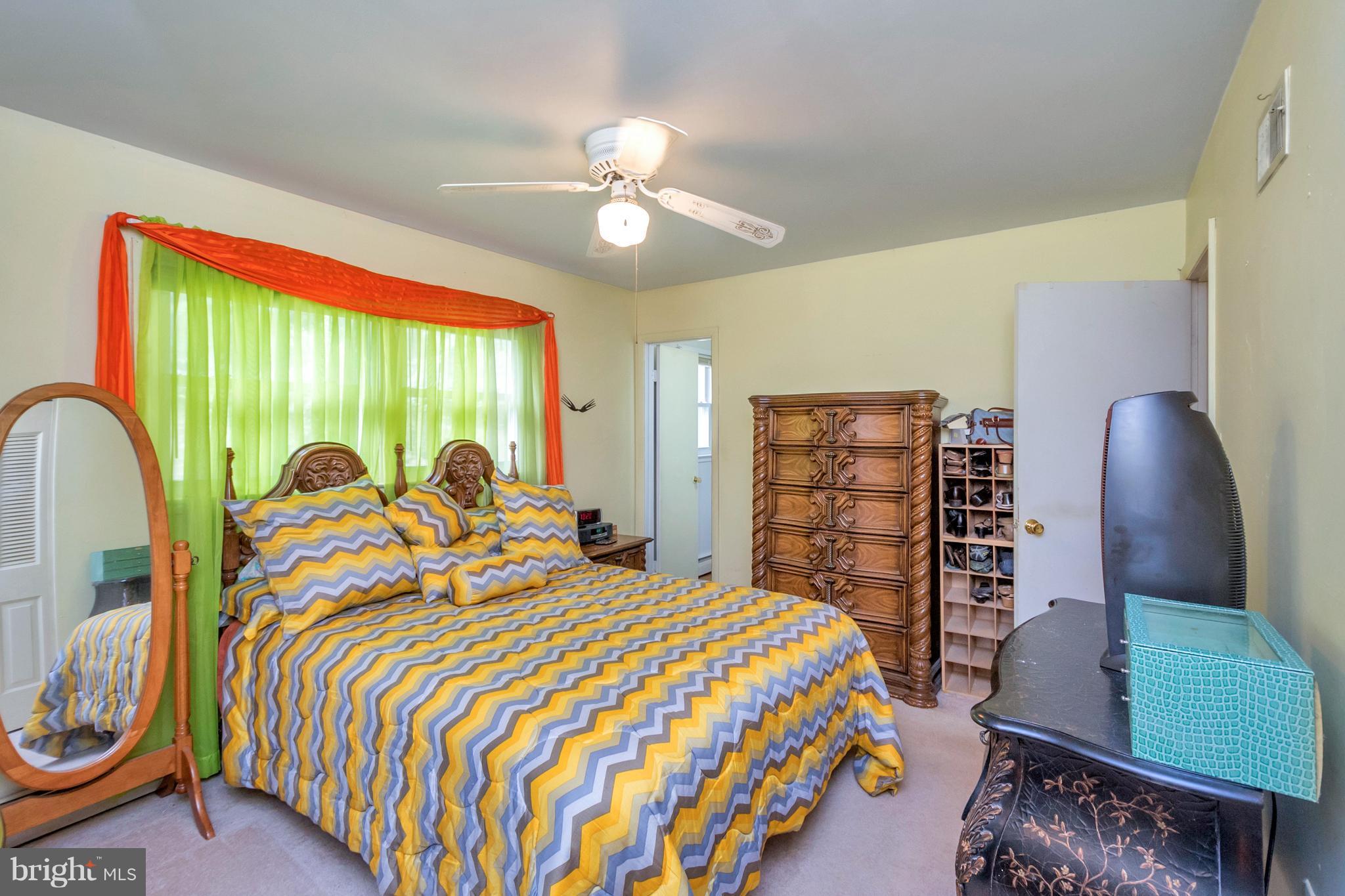 4717 Kilbane Road Woodbridge, VA 22193 - Photo 15 of 29 a bedroom with a bed and a painting on the wall