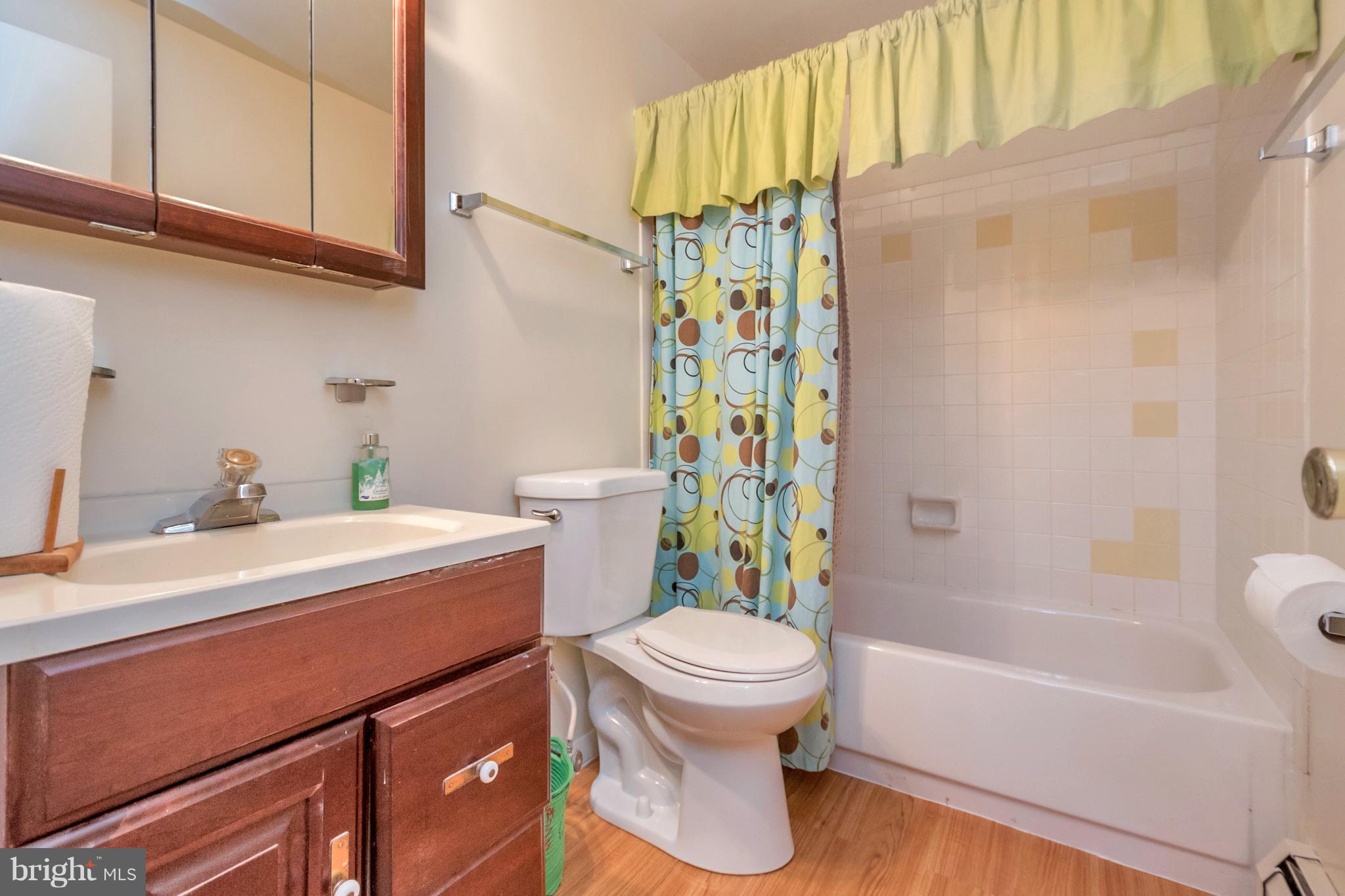 4717 Kilbane Road Woodbridge, VA 22193 - Photo 17 of 29 a bathroom with a sink toilet and shower