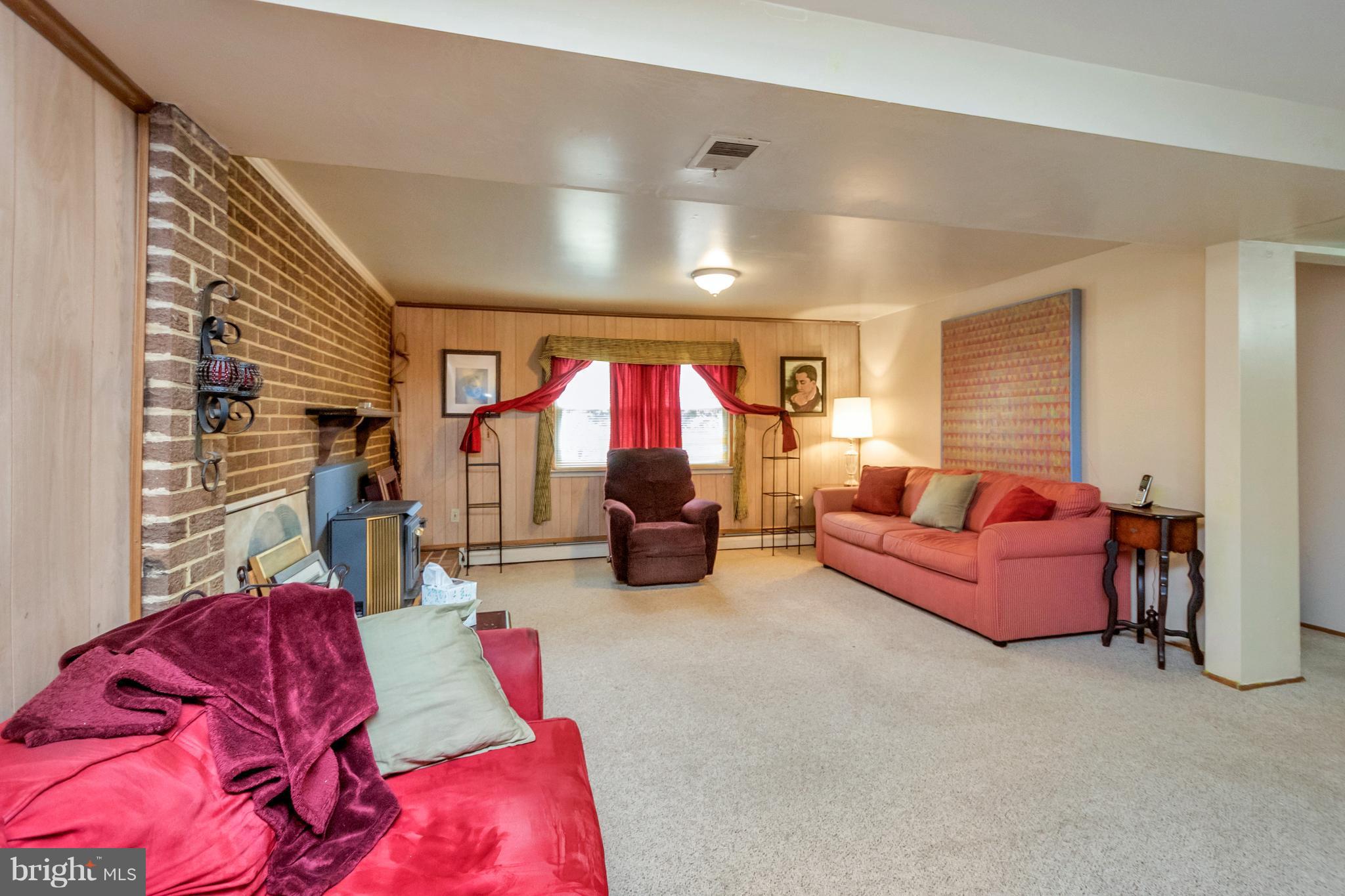 4717 Kilbane Road Woodbridge, VA 22193 - Photo 19 of 29 a living room with furniture fireplace and flat screen tv