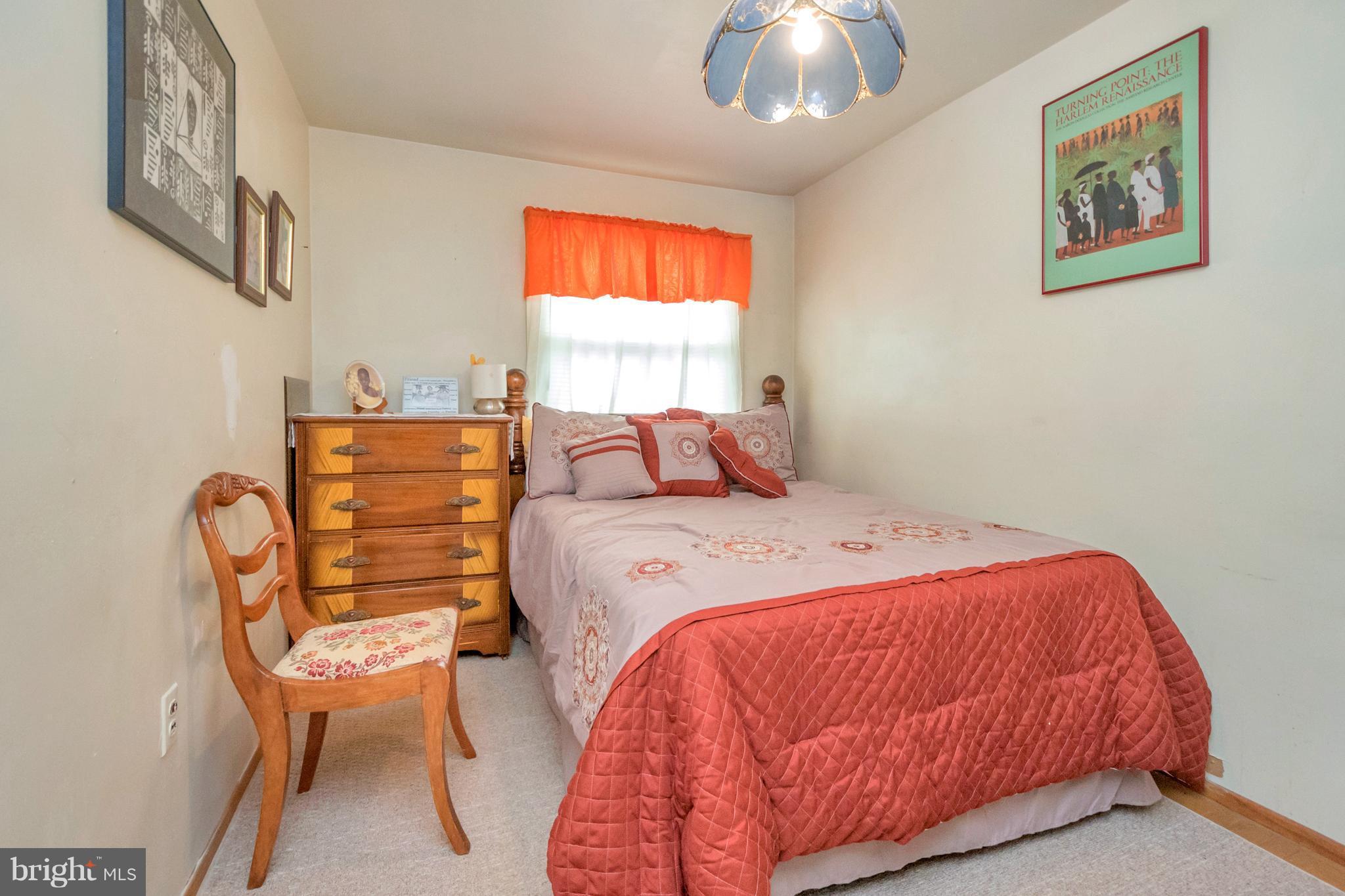 4717 Kilbane Road Woodbridge, VA 22193 - Photo 23 of 29 a bedroom with a bed and chair