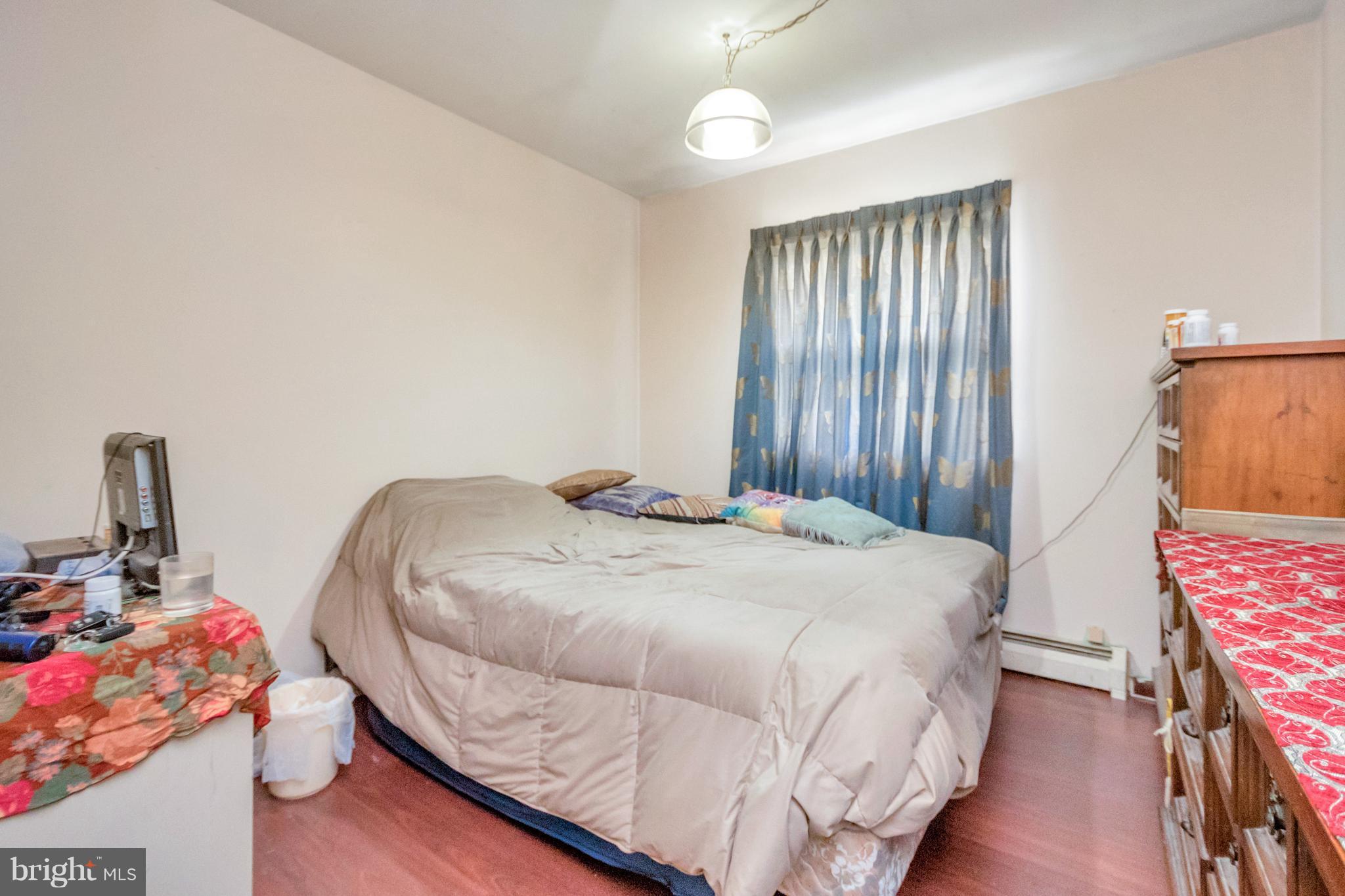 4717 Kilbane Road Woodbridge, VA 22193 - Photo 25 of 29 a bedroom with a bed and wooden floor