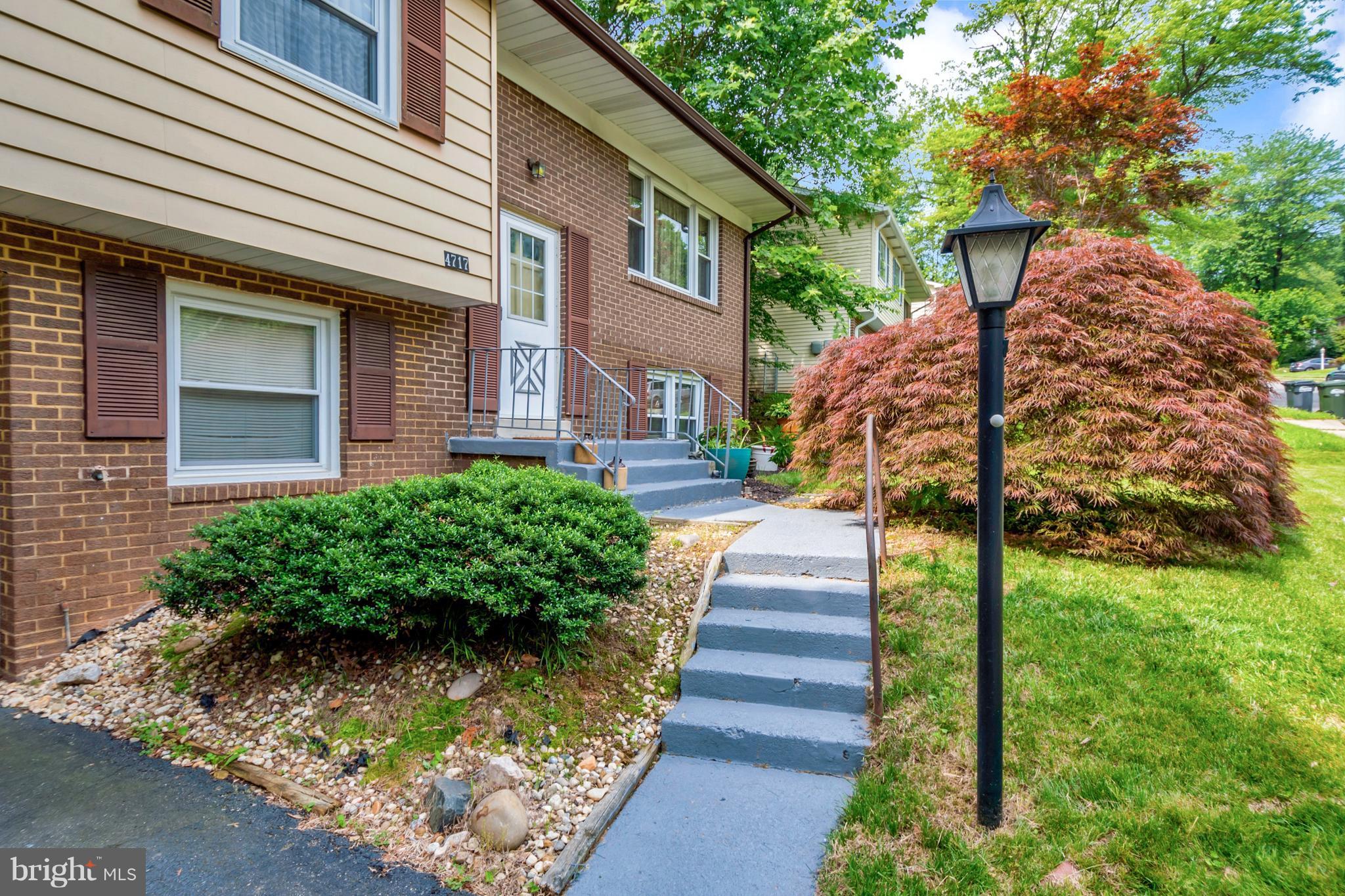 4717 Kilbane Road Woodbridge, VA 22193 - Photo 3 of 29 a front view of a house with a yard