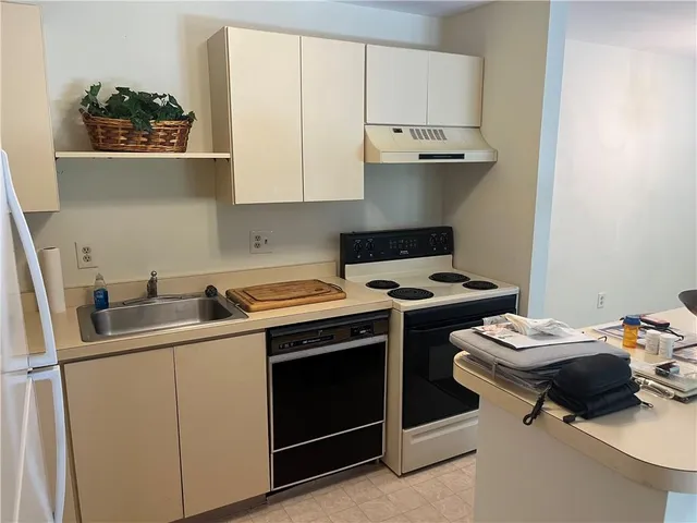 a kitchen with a stove and a sink
