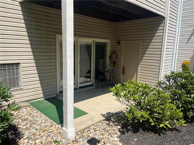 a view of a house with a small garden