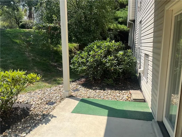 a view of a back yard of a house