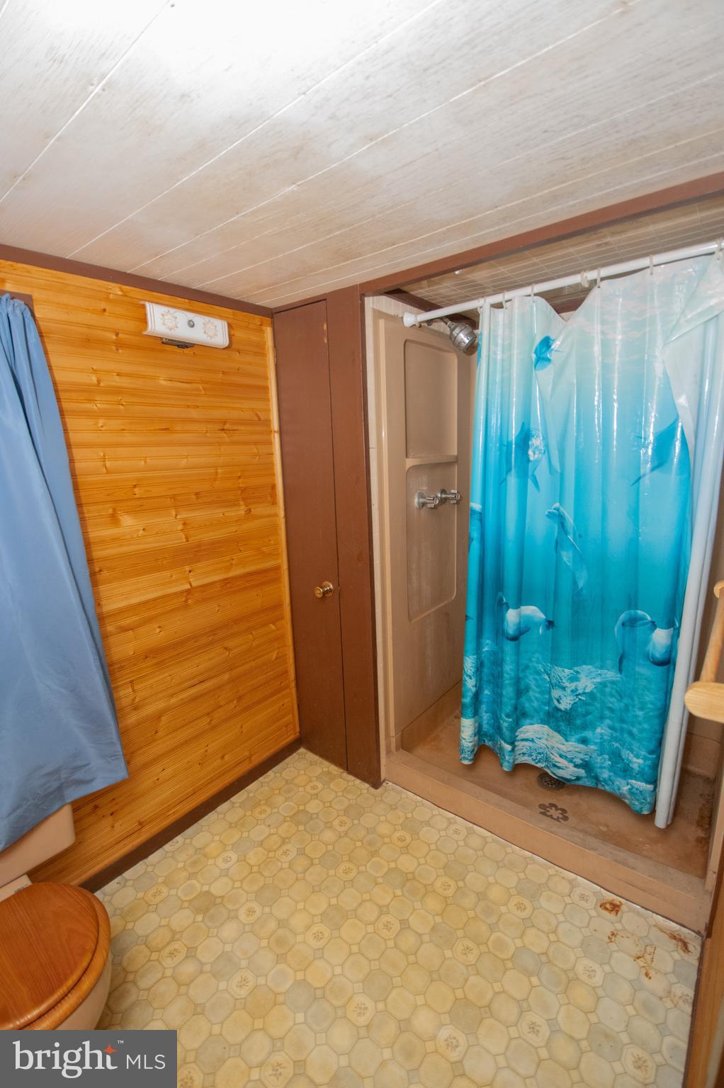 37245 Firemans Road Millsboro, DE 19966 - Photo 12 of 31 a view of a room with a door and wooden floor