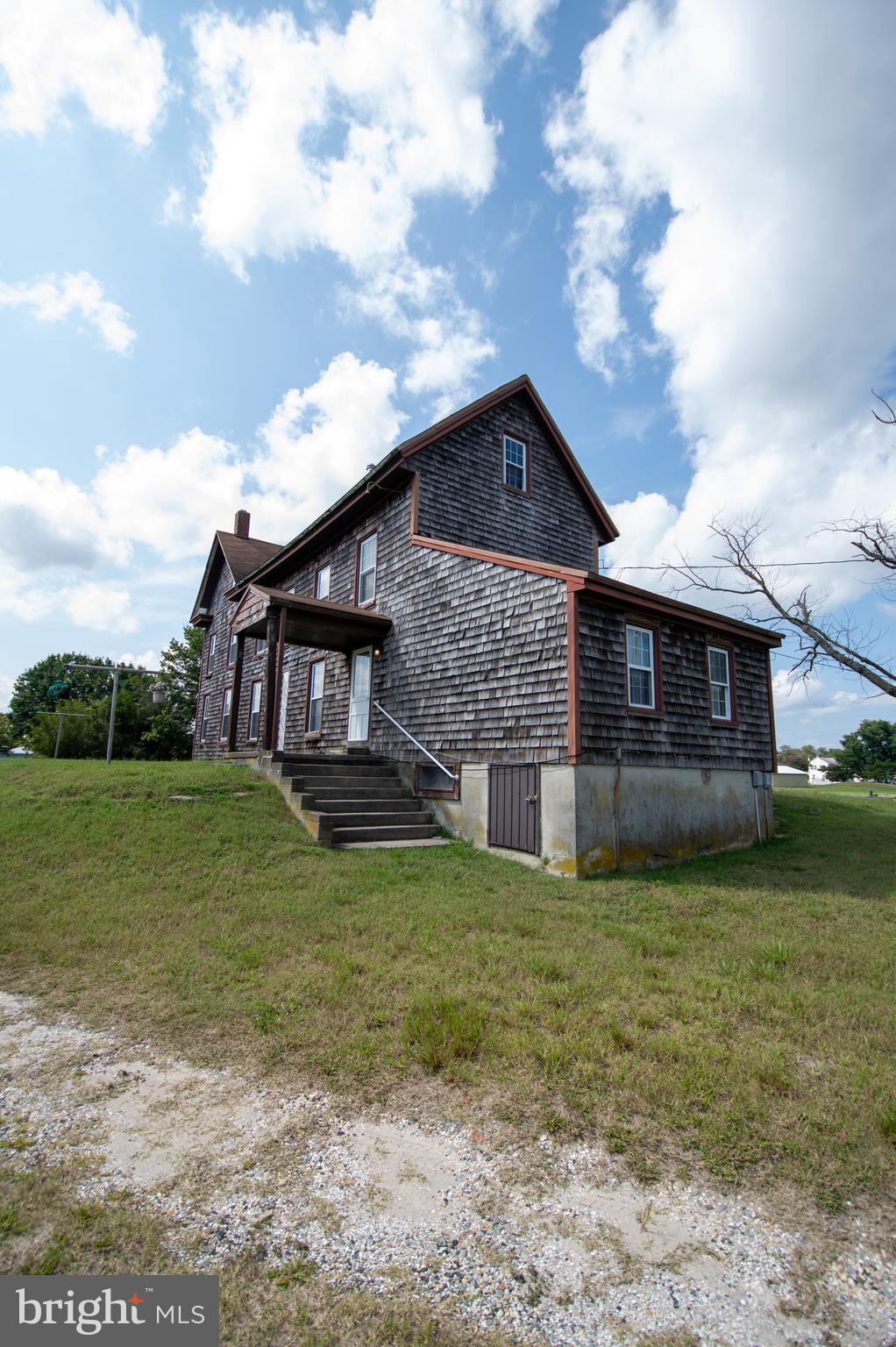 37245 Firemans Road Millsboro, DE 19966 - Photo 16 of 31 a view of a yard in front of a house with a large tree