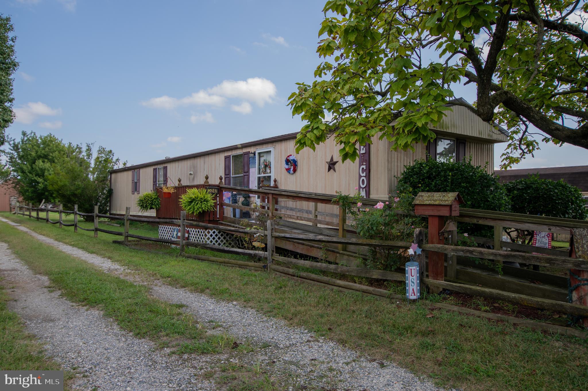 37245 Firemans Road Millsboro, DE 19966 - Photo 18 of 31 a view of a house with a back yard