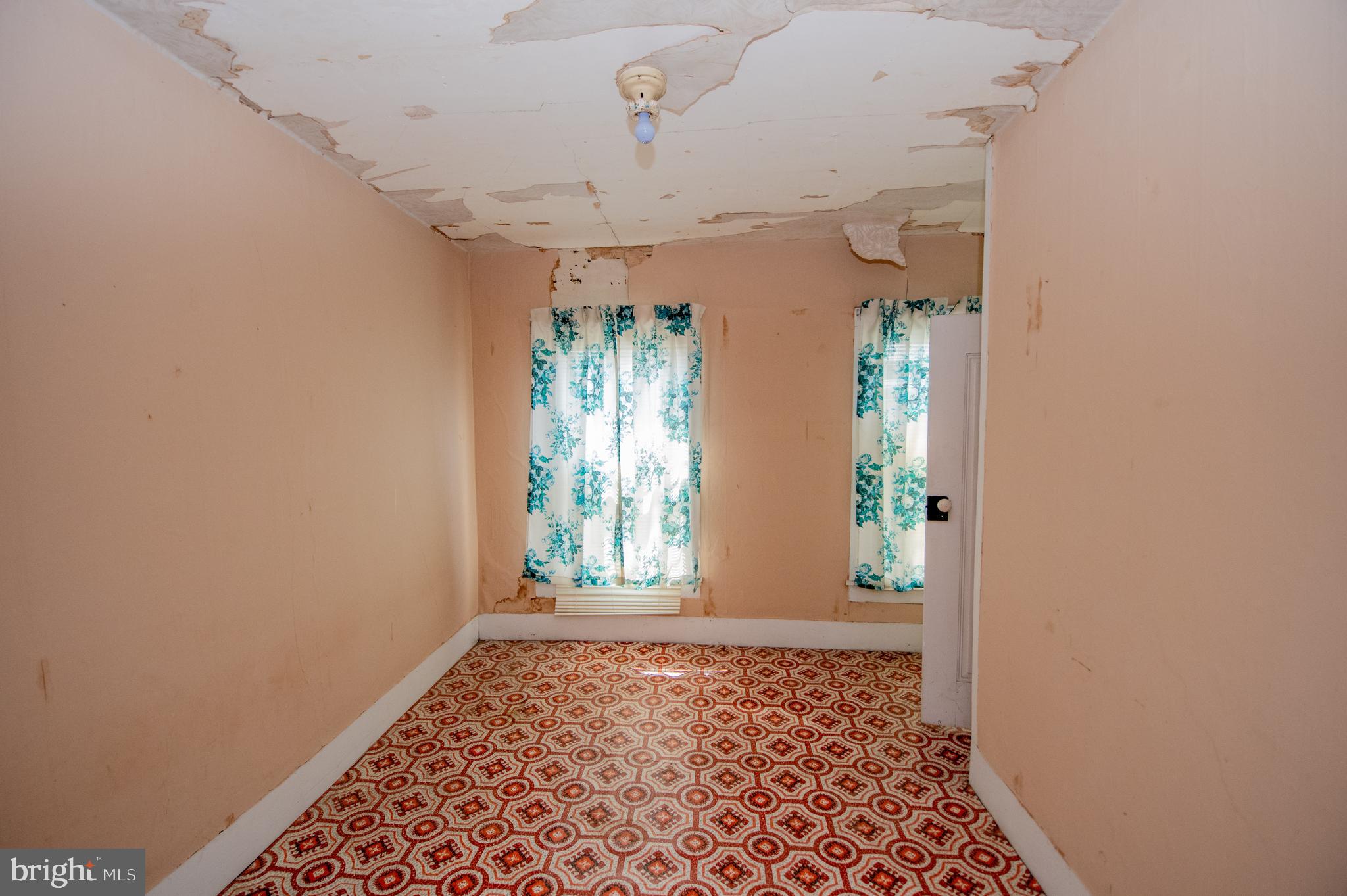 37245 Firemans Road Millsboro, DE 19966 - Photo 6 of 31 wooden floor in an empty room with a window