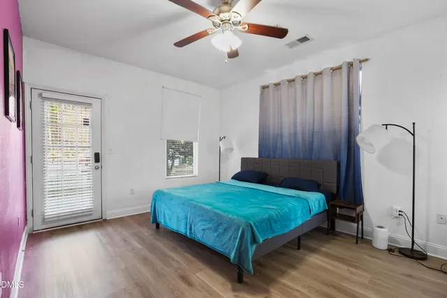 a bedroom with a bed and a walk in closet