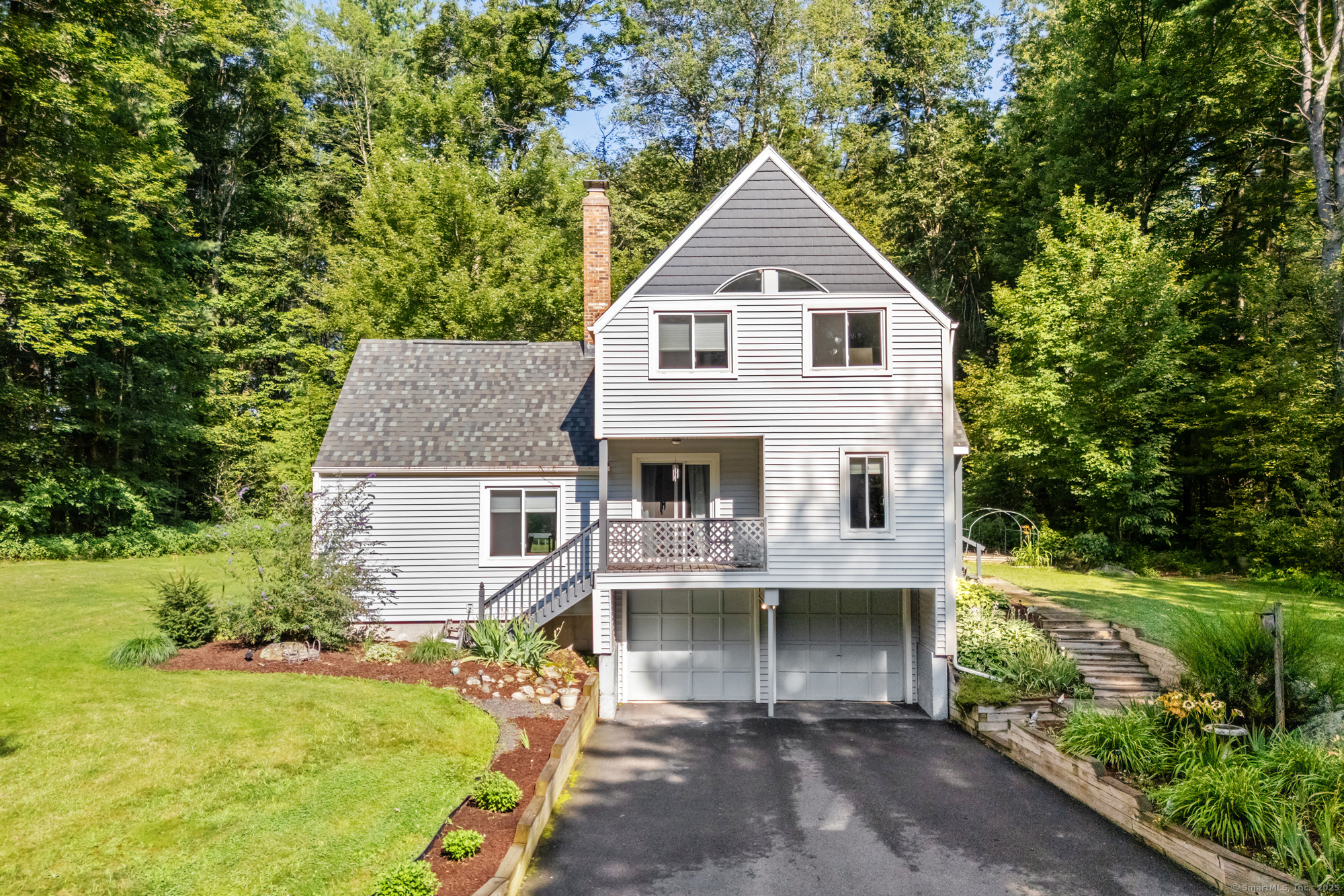 65 Day Street Granby, CT 06035 - Photo 1 of 1 a front view of a house with garden
