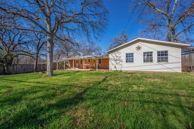 a view of a house with a big yard
