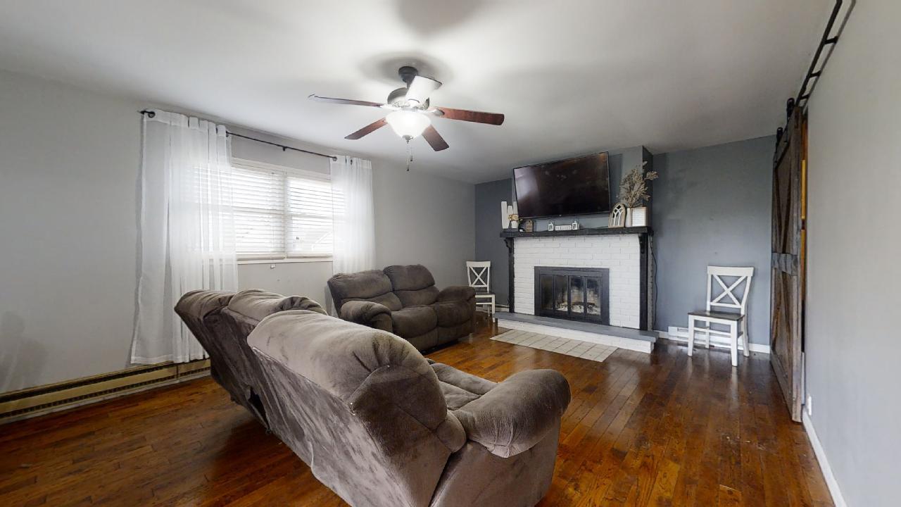 405 Park Circle St. Joseph, IL 61873 - Photo 13 of 35 a living room with furniture and a fireplace