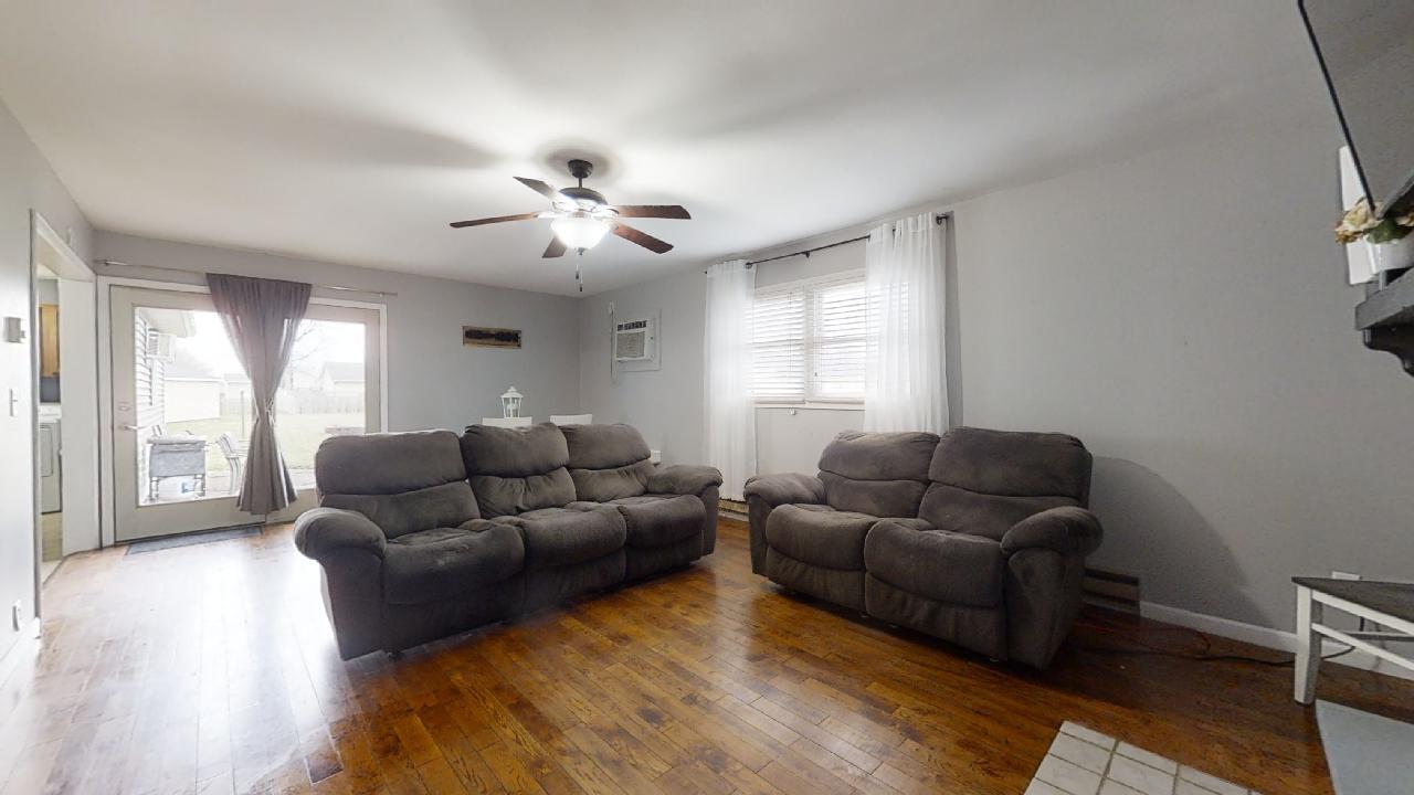 405 Park Circle St. Joseph, IL 61873 - Photo 14 of 35 a living room with furniture and a large window