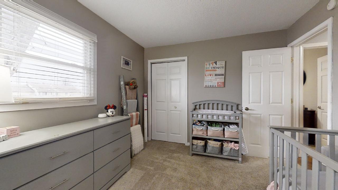 405 Park Circle St. Joseph, IL 61873 - Photo 24 of 35 a bedroom with a bed and a window