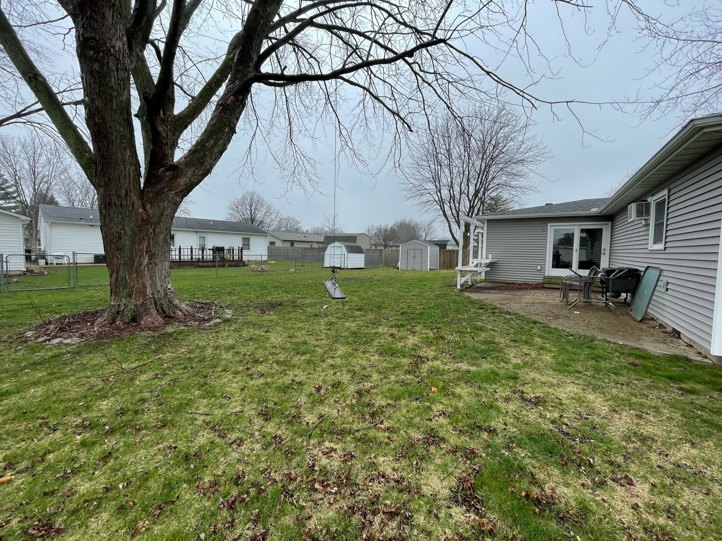 405 Park Circle St. Joseph, IL 61873 - Photo 29 of 35 a backyard of a house with table and chairs