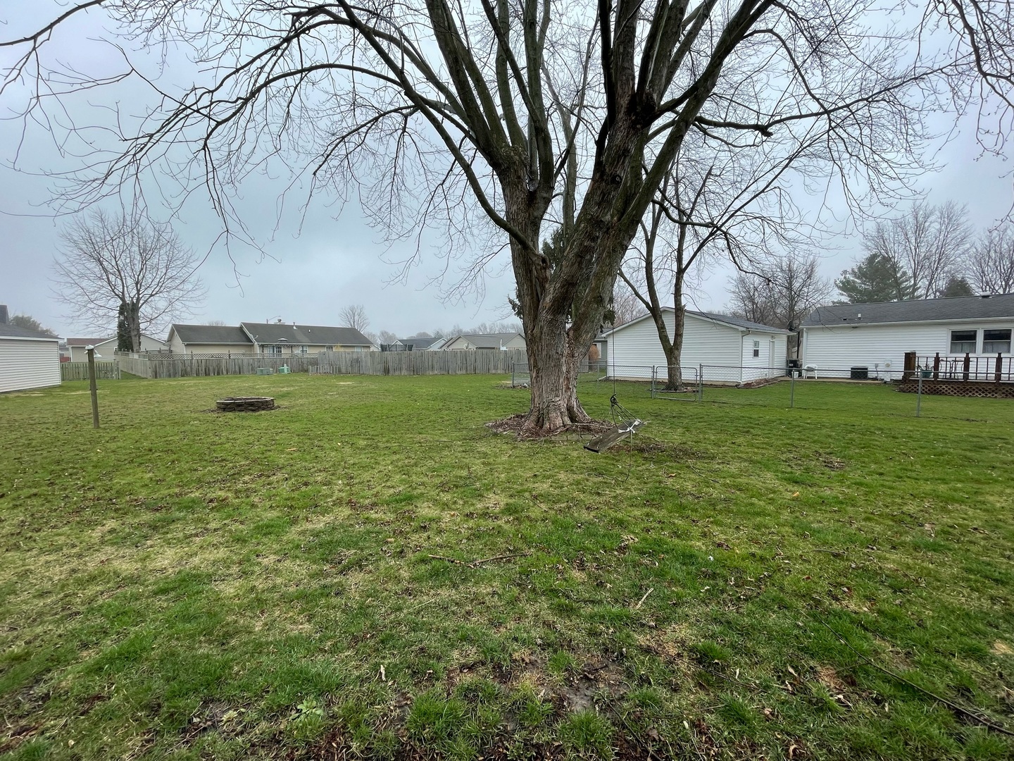 405 Park Circle St. Joseph, IL 61873 - Photo 32 of 35 a view of a yard with a tree