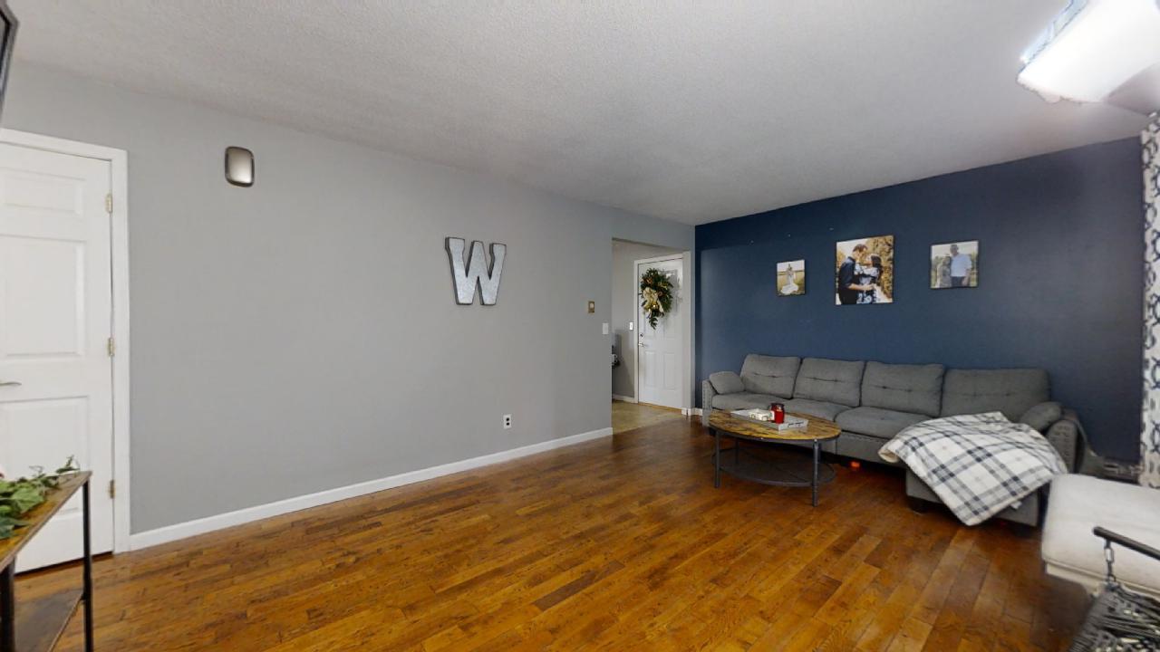 405 Park Circle St. Joseph, IL 61873 - Photo 4 of 35 a living room with furniture and a hard wood floor