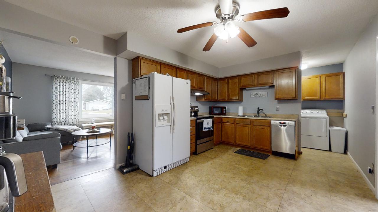 405 Park Circle St. Joseph, IL 61873 - Photo 7 of 35 a kitchen with refrigerator cabinets and furniture