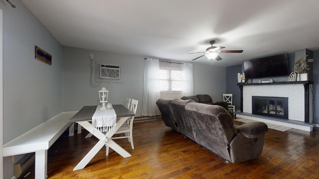405 Park Circle St. Joseph, IL 61873 - Photo 10 of 35 a living room with furniture and a fireplace