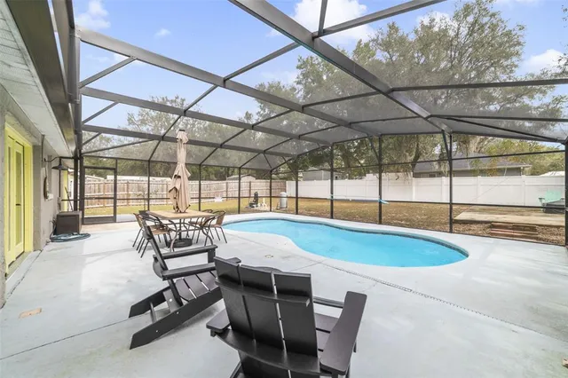 a dining room with a table and chairs