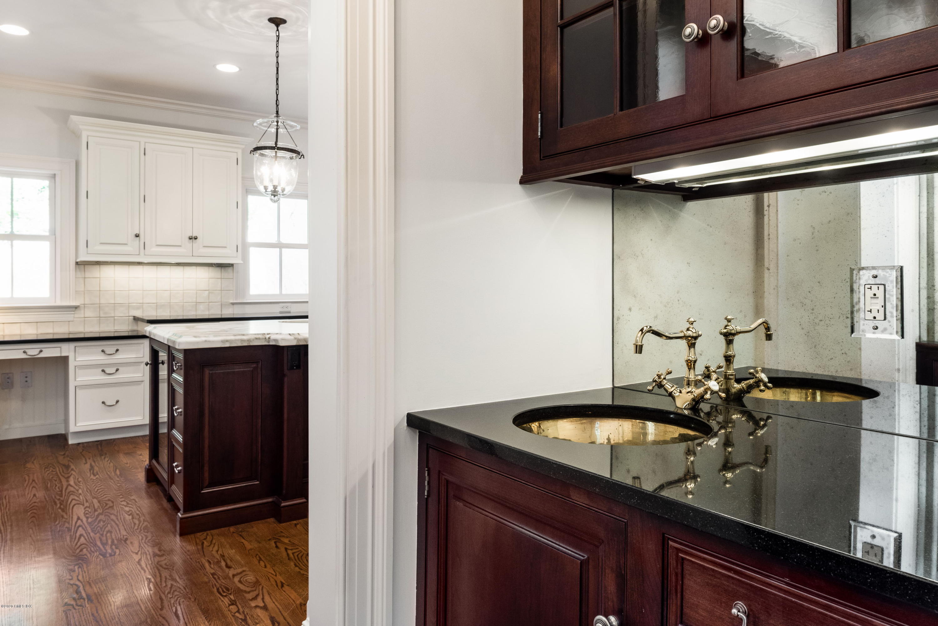 53 Hillside Road Greenwich, CT 06830 - Photo 12 of 31 a kitchen with a sink appliances and cabinets
