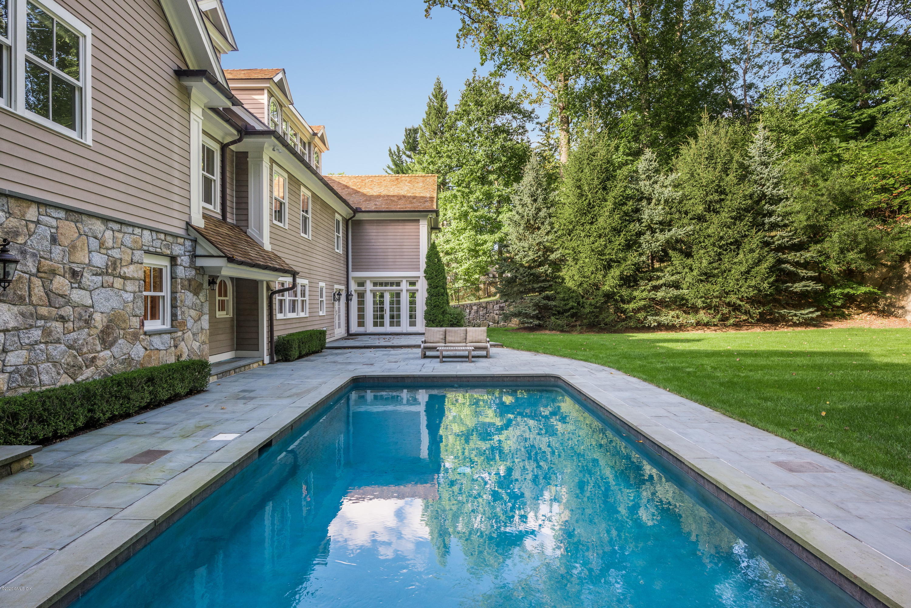 53 Hillside Road Greenwich, CT 06830 - Photo 27 of 31 a view of a house with a yard