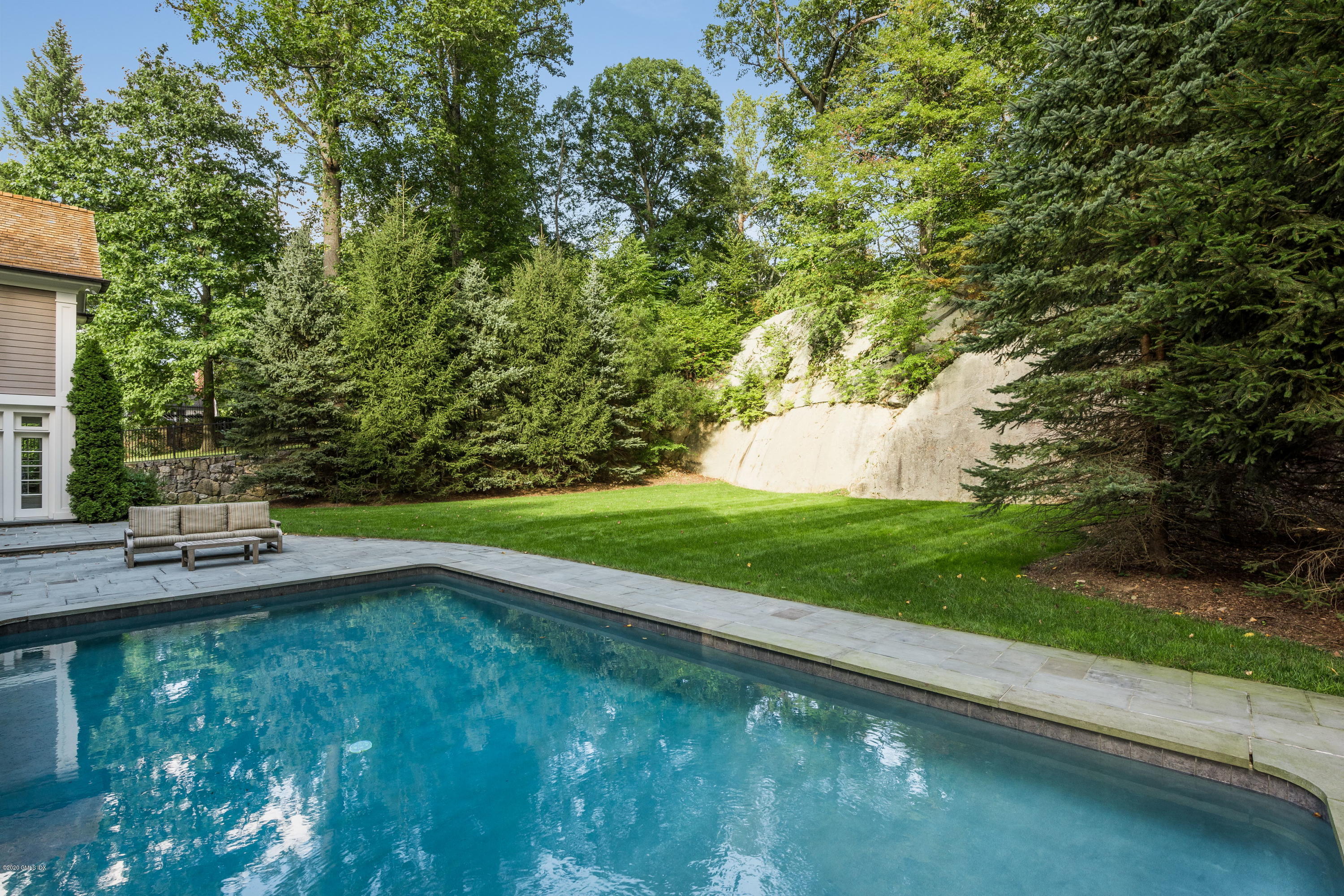 53 Hillside Road Greenwich, CT 06830 - Photo 28 of 31 a view of a backyard with a garden