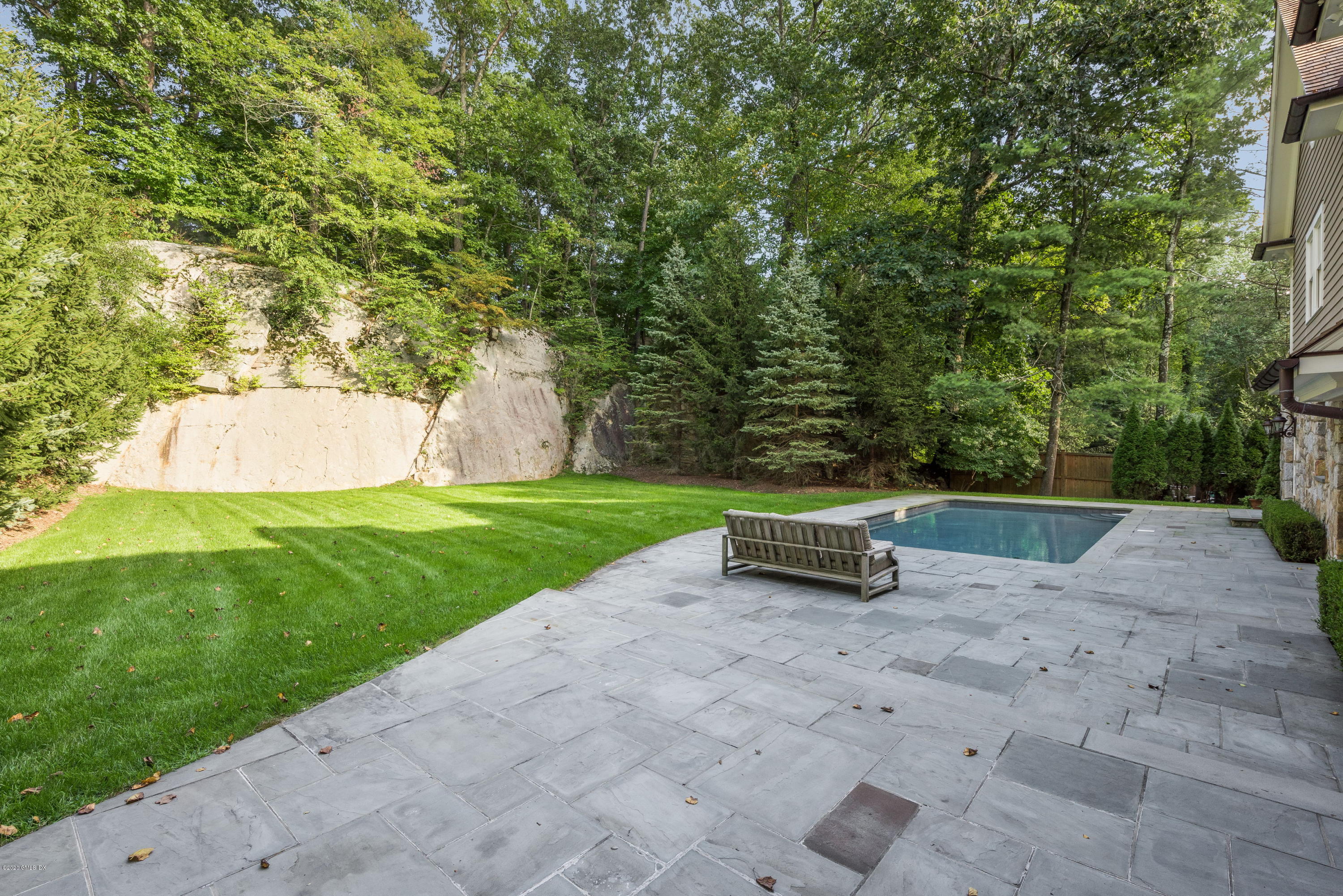 53 Hillside Road Greenwich, CT 06830 - Photo 29 of 31 a view of a bench in a park