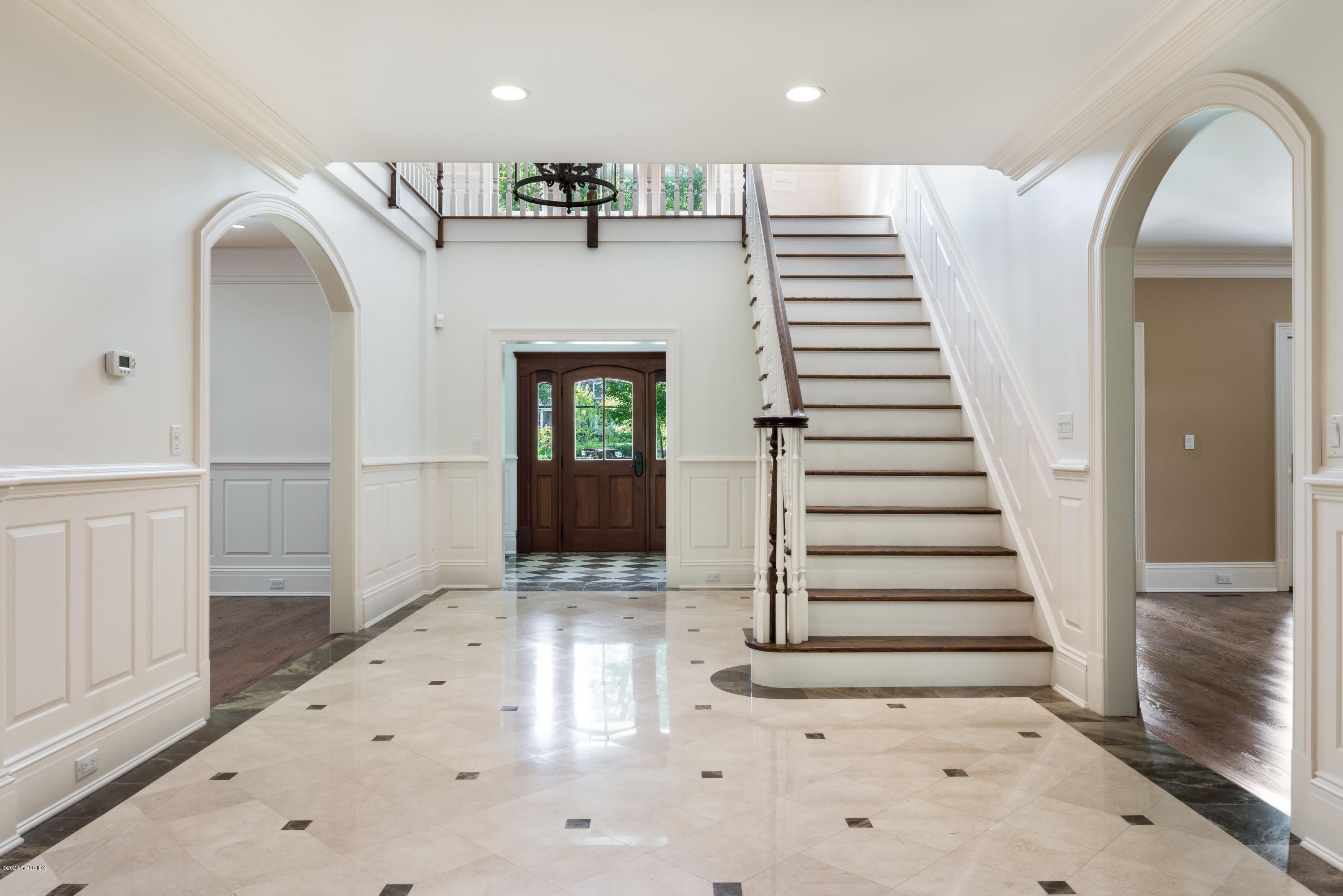 53 Hillside Road Greenwich, CT 06830 - Photo 5 of 31 a view of entryway with wooden floor and stairs