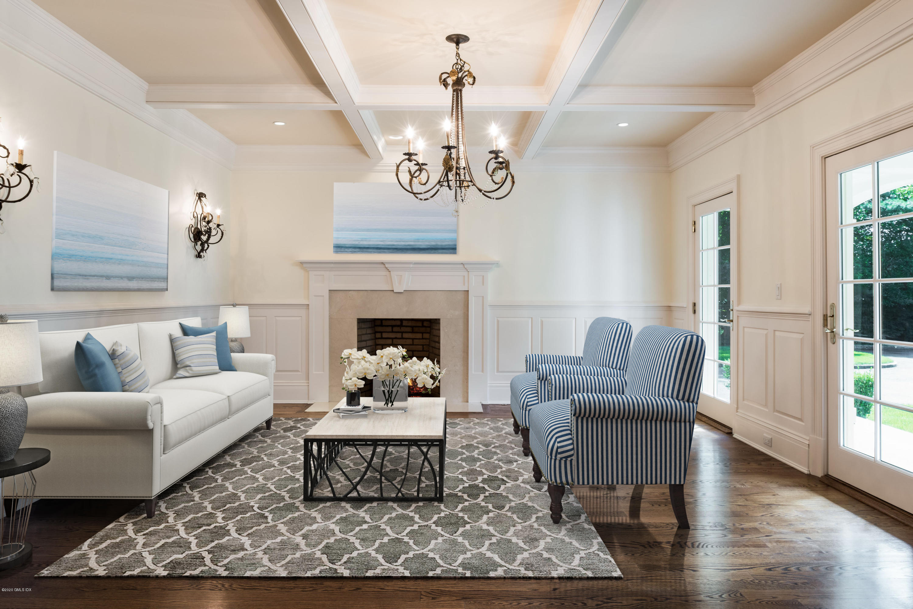 53 Hillside Road Greenwich, CT 06830 - Photo 6 of 31 a living room with furniture a chandelier and a fireplace