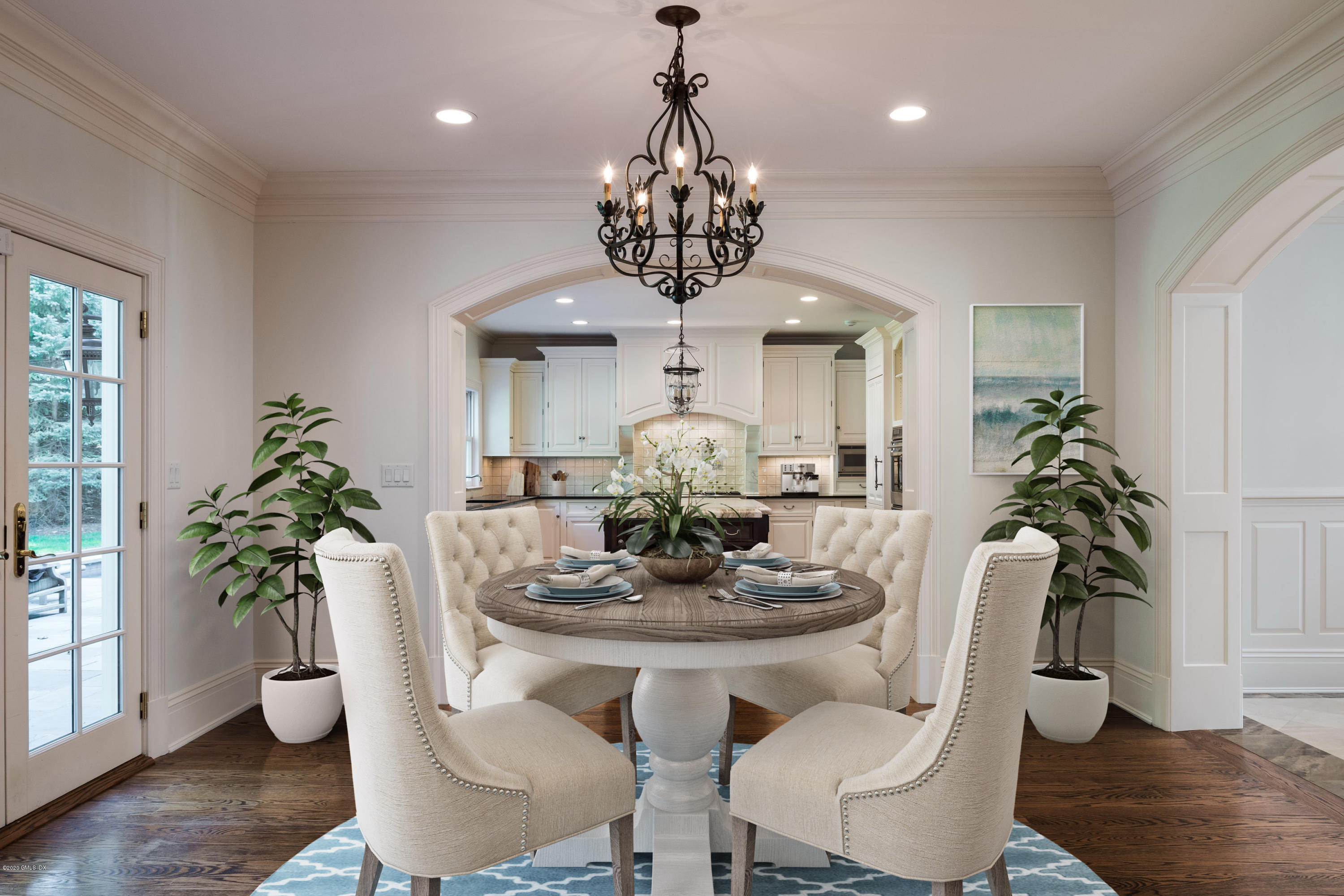 53 Hillside Road Greenwich, CT 06830 - Photo 10 of 31 a dining room with furniture potted plants and wooden floor