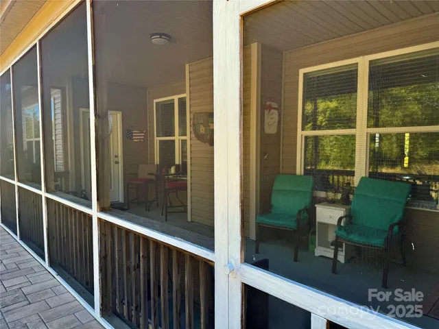 a view of a balcony with chairs
