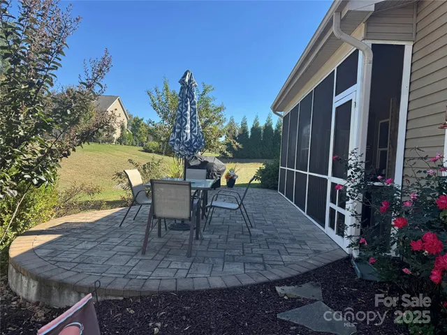 a view of a chairs and table in the patio
