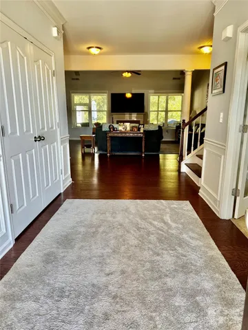 an entryway and livingroom with furniture