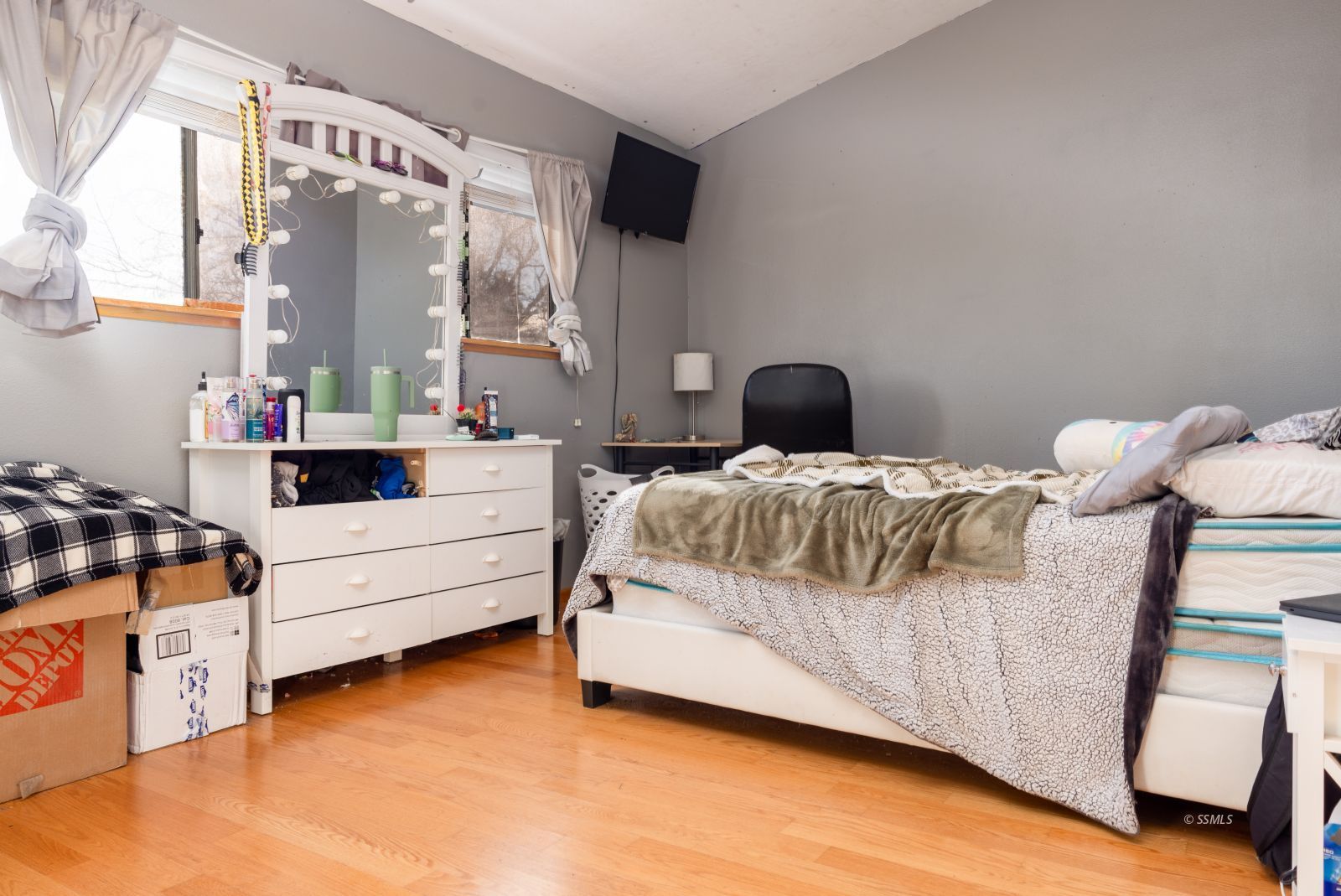 737 Mamie Street Ridgecrest, CA 93555 - Photo 24 of 41 a bedroom with a bed and large windows