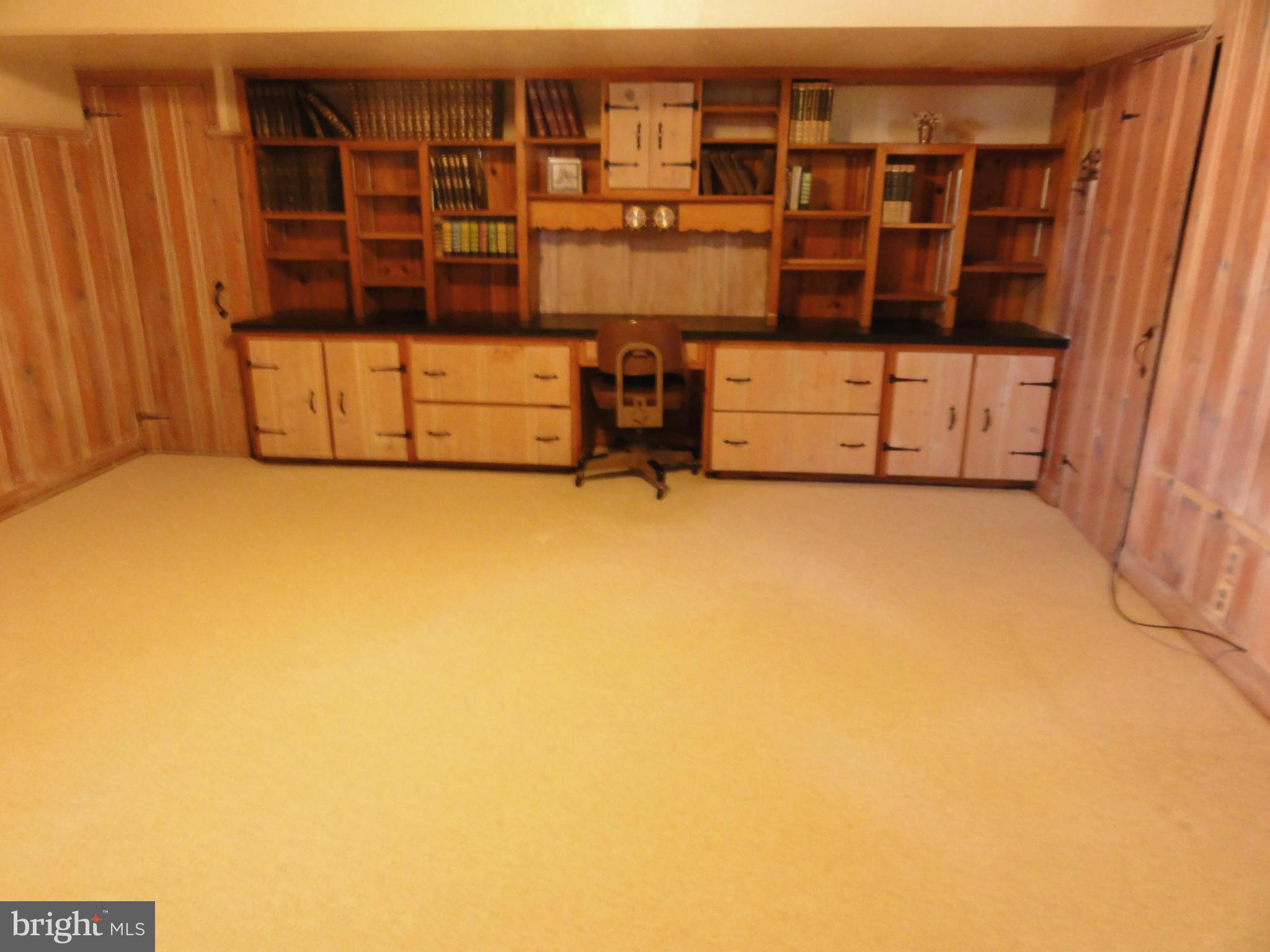 1501 Clairidge Road Baltimore, MD 21207 - Photo 17 of 28 Family room with built-in bookcase and desk.