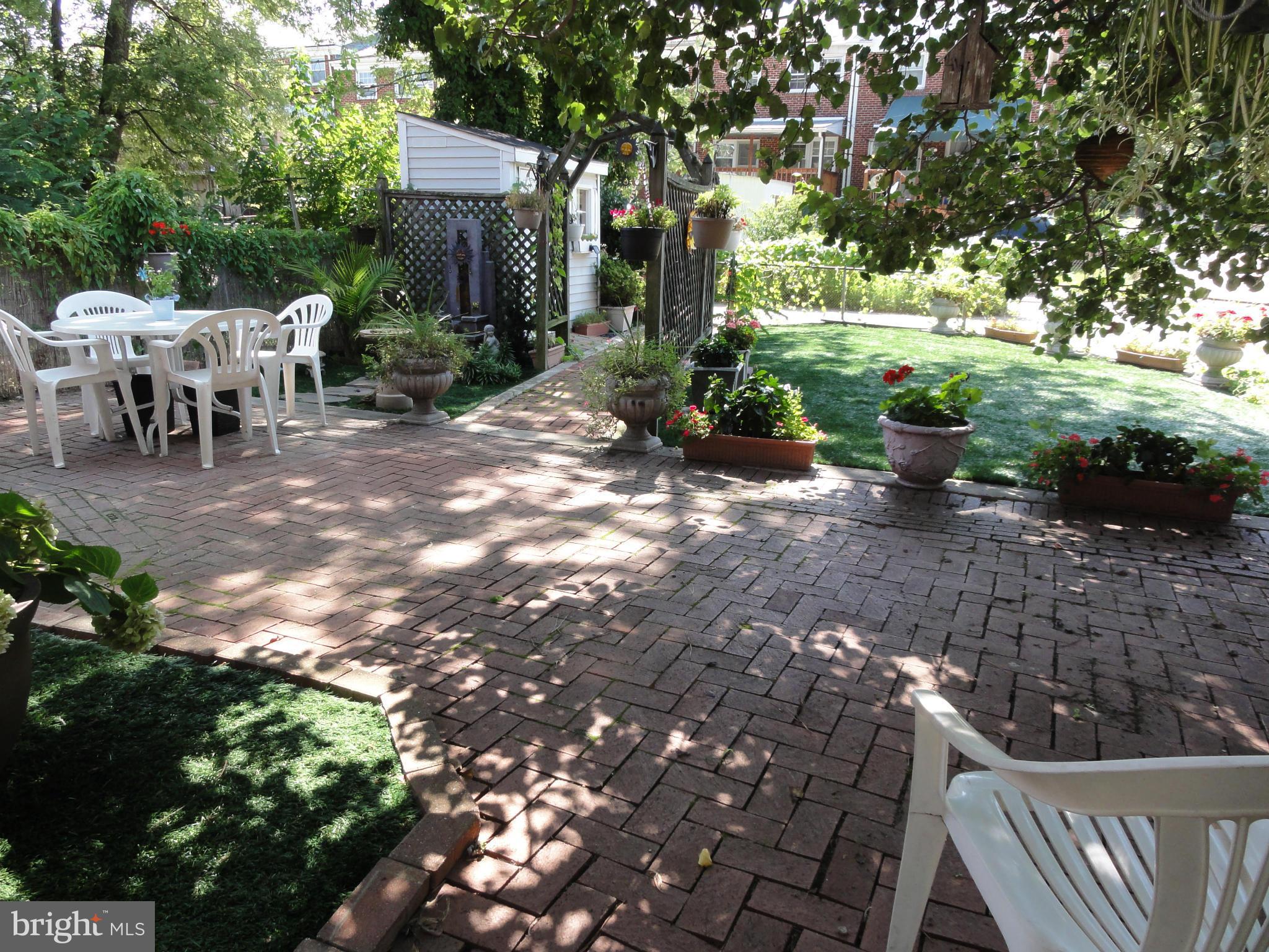 1501 Clairidge Road Baltimore, MD 21207 - Photo 25 of 28 Brick patio with mature shade tree.