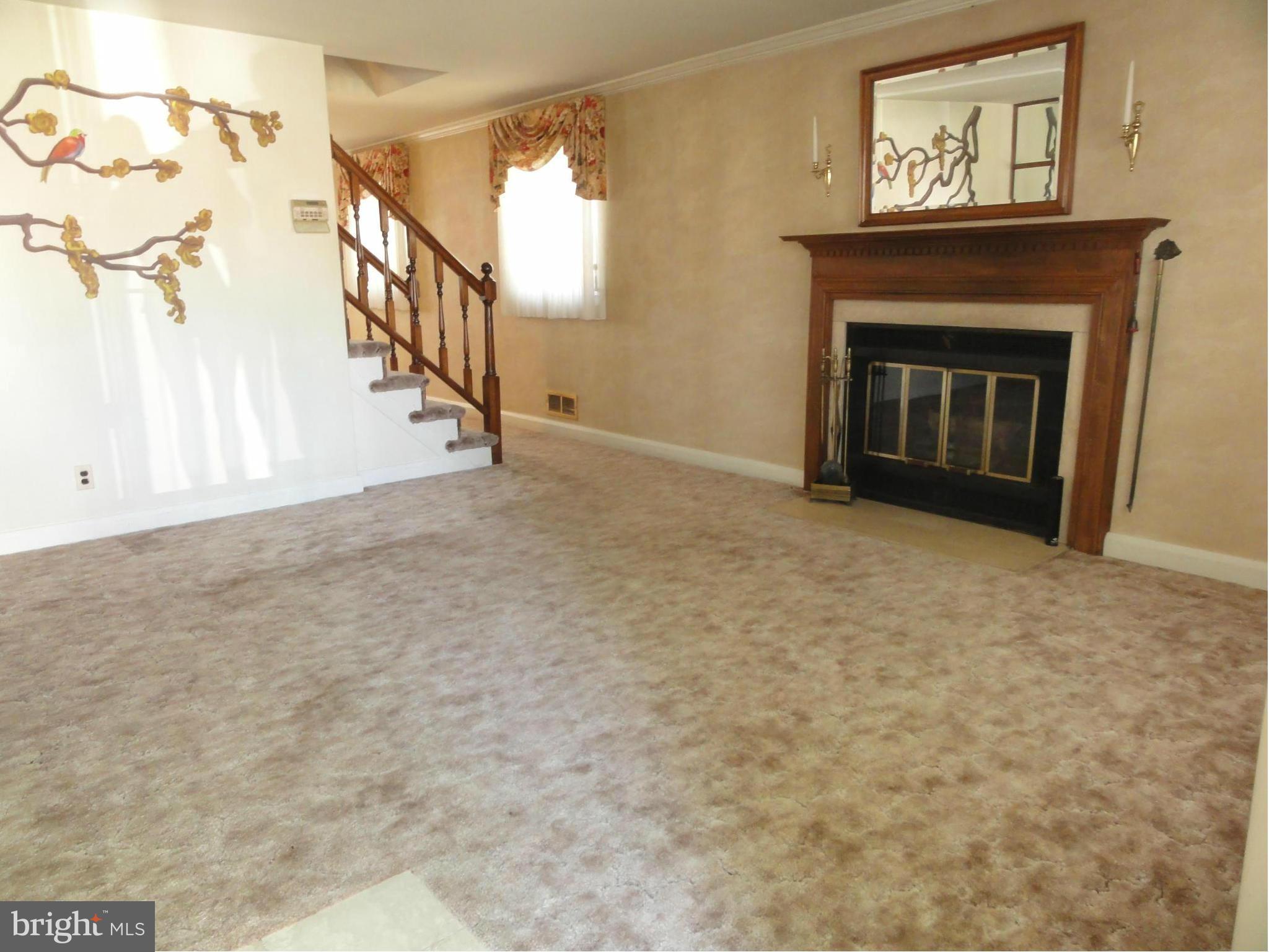 1501 Clairidge Road Baltimore, MD 21207 - Photo 6 of 28 Inviting living room with hardwood under carpet.