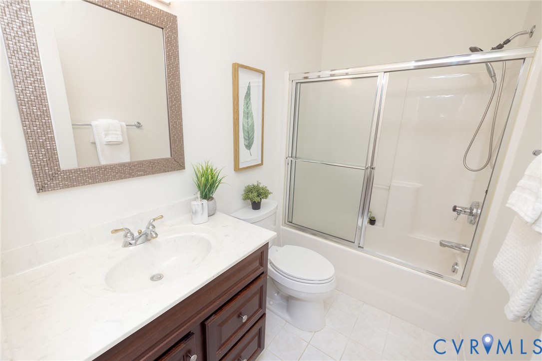 5713 Promontory Place Midlothian, VA 23112 - Photo 29 of 39 a bathroom with a sink a toilet and a mirror