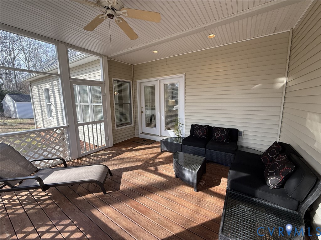 5713 Promontory Place Midlothian, VA 23112 - Photo 31 of 39 a living room with furniture fireplace and a flat screen tv